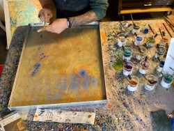 Artisan demonstrating paper marbling